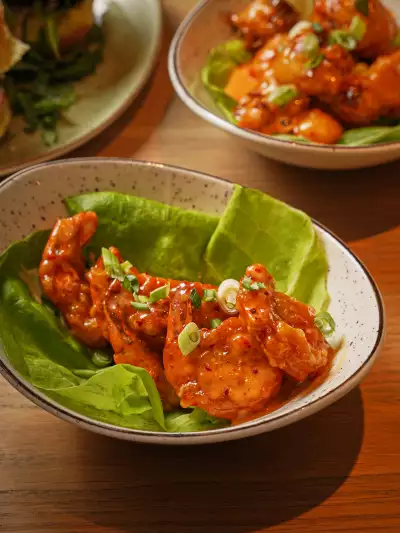 Dynamite Shrimp served on lettuce at 11:59 Bar:Café
