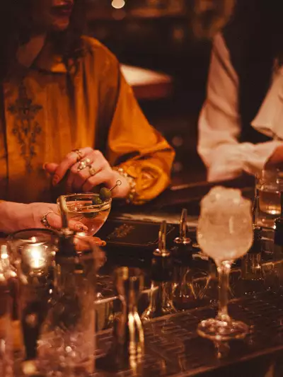 The best bars in Toronto | A guest enjoying a martini at Goodnight Cocktail Club