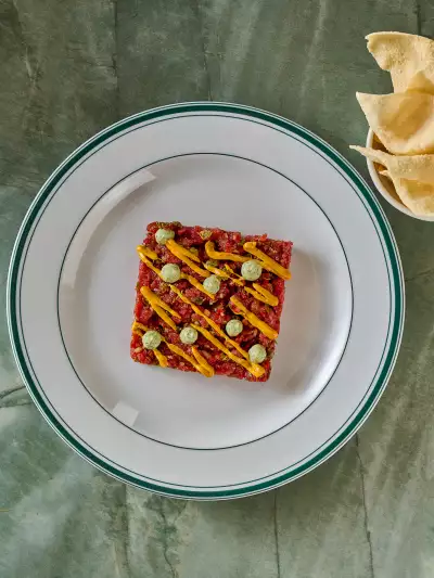 Best new restaurants Toronto | Curried lamb tartare is served with a poppadom at General Public