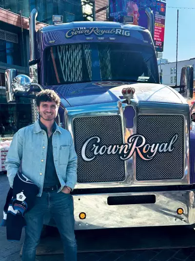 Hunter Gutman standing beside the Crown Royal Rig