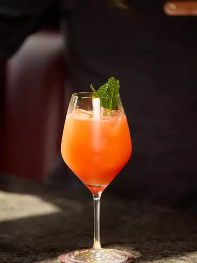 A bright orange cocktail at Lyla Toronto