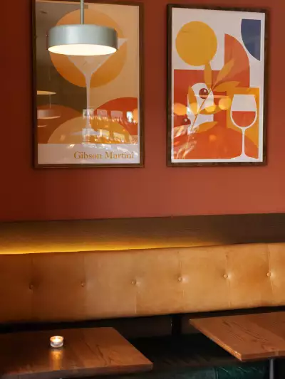Art above a banquette at Bar Allegro