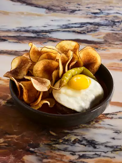Best patios Toronto | An egg and chips dish at Taberna Lx