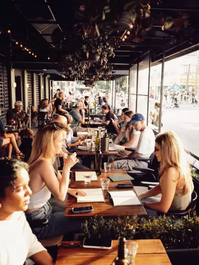 The best patios in Toronto | A view of diners on the side patio at Contrada on College Street
