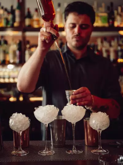 The best patios in Toronto | A bartender preps and pours cocktails at Contrada on College Street