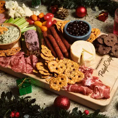 A seven-foot charcuterie board filled with pretzel crisps