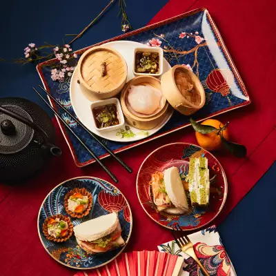 A spread of savoury snacks, bamboo steamer baskets and tea at Holts Caf&eacute; Lunar New Year Afternoon Tea