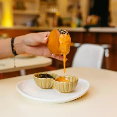Simpl Things | The Sesame Shrimp Toast dripping with sauce at Simpl Things in Parkdale