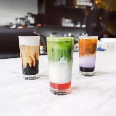 The best cafes in Toronto | An ube latte, strawberry matcha latte and iced mocha at 10 Dean