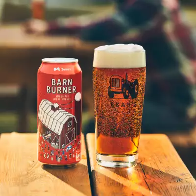 Fall drinks: Beau's Barn Burner Amber Ale on a picnic table