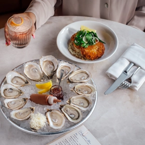 Oysters and a cocktail at Pink Sky