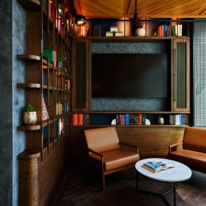 New Toronto restaurants | A TV, bookshelf and loungers at TABLE Fare + Social