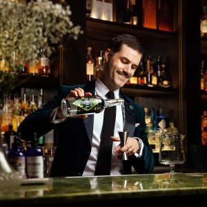 James Grant making a cocktail at Library Bar
