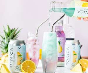 Pouring Tonica Lemonade Kombucha into a glass