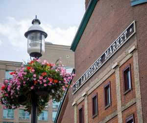 Flowers hang outside the St. Lawrence Market