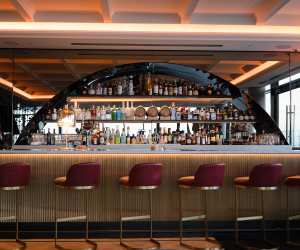 Valerie | The bar and alcohol bottles at Valerie in Hotel X Toronto
