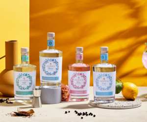 Four bottles of Ceder's with spices on a white table