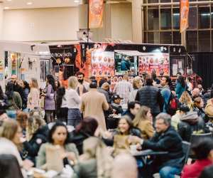 A crowd of people around a food truck at T.O. Food and Drink Fest