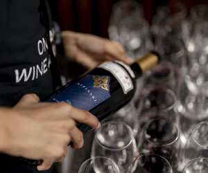 Pouring a bottle of wine at the Ontario Wine Awards