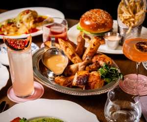 La Plume Toronto | A spread of dishes at La Plume in The Well