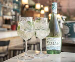 Two glasses and a bottle of Croft Twist