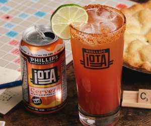 Phillips iOTA Non-Alc beer | A Michelada cocktail sits next to a can of  iOTA Hazy IPA