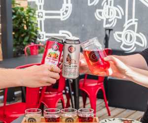 Brickworks Ciderhouse Toronto craft cider | Hands holding Batch: 1904 and seasonal ciders