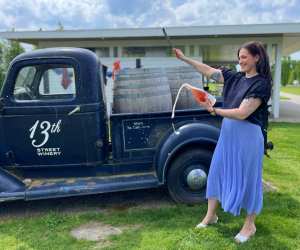 13th Street Winery, Niagara | Renée Sferrazza sabring a bottle at 13th Street Winery in Niagara