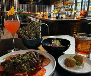 Flat iron steak and other dishes at Runway06