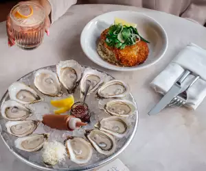 Oysters and a cocktail at Pink Sky