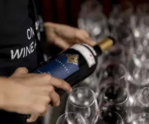 Pouring a bottle of wine at the Ontario Wine Awards