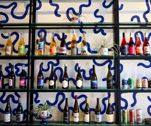 Ricky + Olivia | Shelves of all-Ontario wine at the bottle shop at Ricky + Olivia