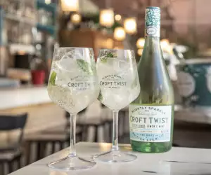 Two glasses and a bottle of Croft Twist