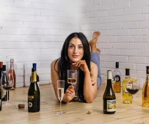 Canadian wine | Wine expert Lauren Power surrounded by wine bottles
