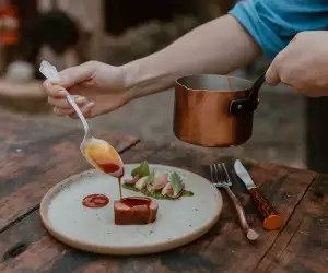 Down Home in Markdale | A plate drizzles sauce over duck at Down Home