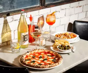 Best new Toronto restaurants | A spread of pizza and wine at Bar Libretto