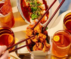 Where to watch the FIFA World Cup in Toronto | Chopsticks reach for a fried chicken bite at Simpl Things in Parkdale