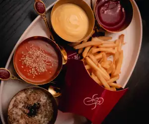 Champagne frites and an assortment of dips at Powder Room