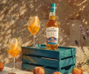 The Glenlivet 12 Year Old Beyond Speyside Series: Provence Edition on a crate with cocktails