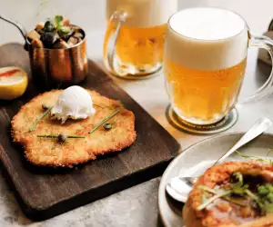 Pilsner Urquell with a spread of dishes